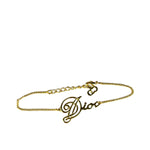 Christian Dior Cursive Logo Gold Tone Bracelet