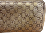 Gucci Metallic Gold Patent Leather GG Zippy Compressed Wallet