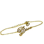 Christian Dior Cursive Logo Gold Tone Bracelet